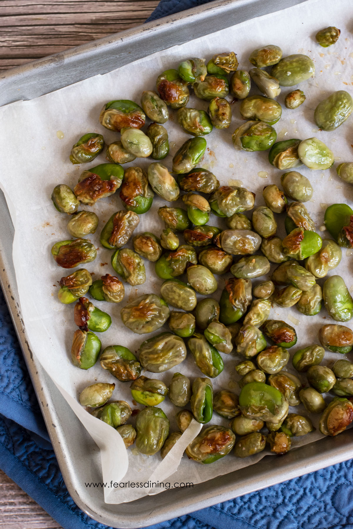 Roasted fava beans on a sheet pan.