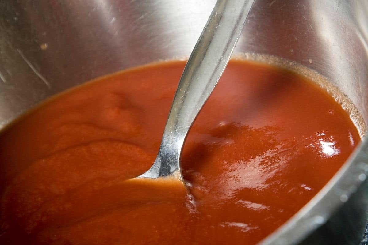 A pot with pureed tomatoes.