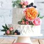 a pinterest image of a wedding cake