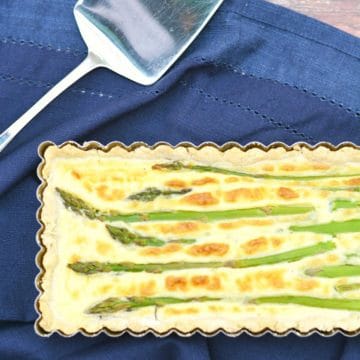 A close up of the asparagus tart in the pan.