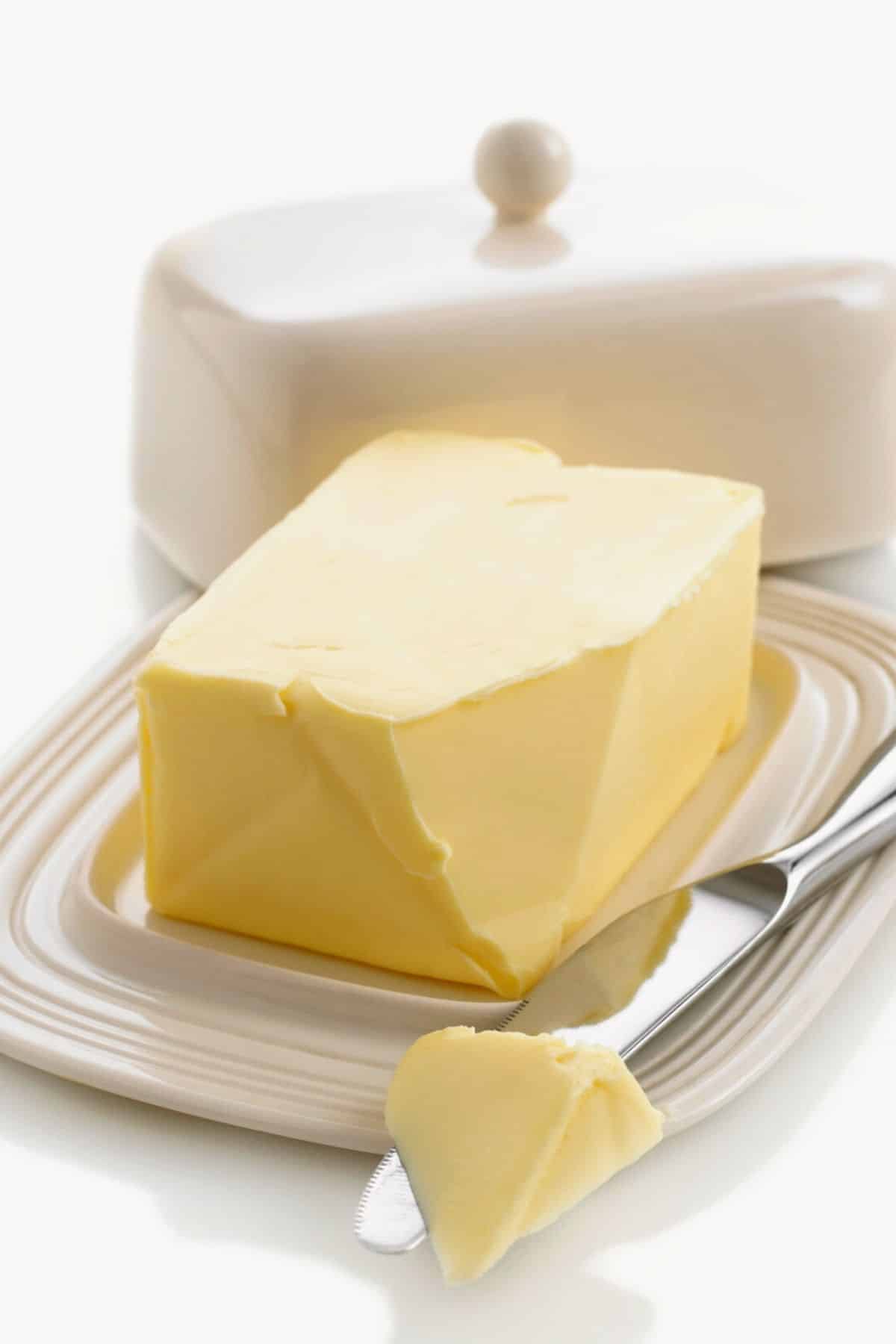 A butter dish with butter.