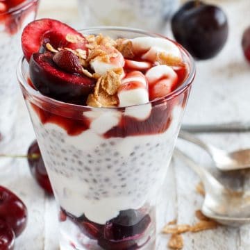 glasses filled with cherry oat milk chia pudding