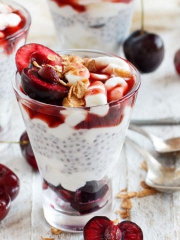 glasses filled with cherry oat milk chia pudding