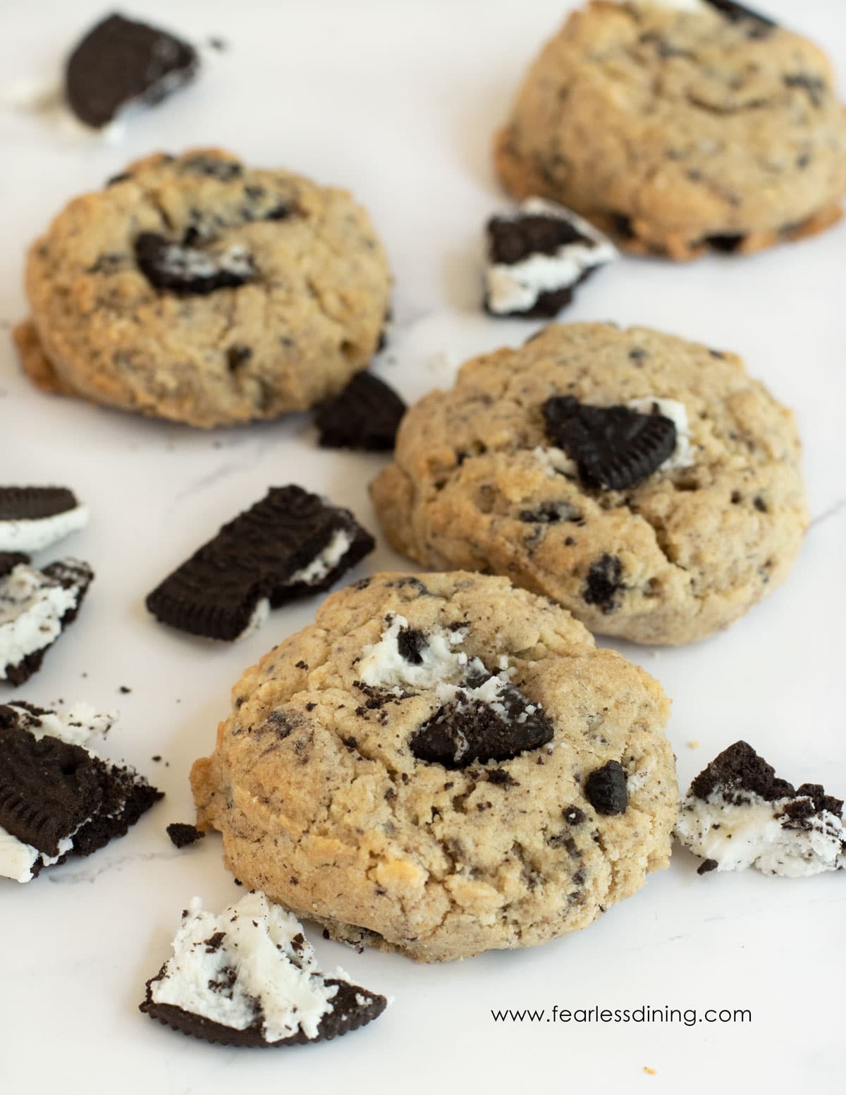 Cookies and cream cookies on a plate with crushed oreos.