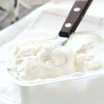 a pinterest image of a tub of cream cheese.