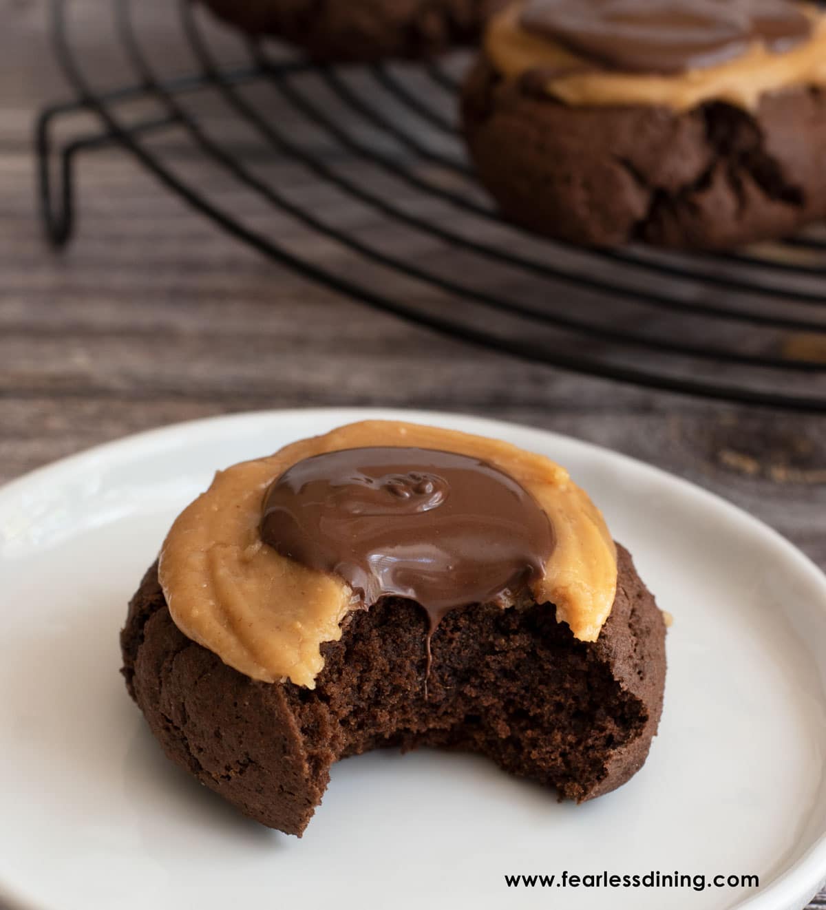 A gluten free buckeye cookie with a bite taken out.