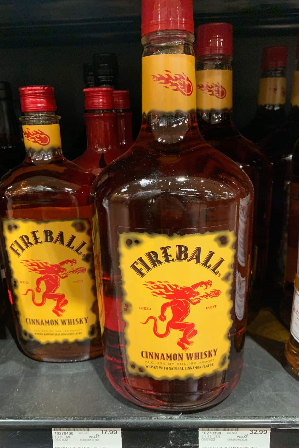 Bottles of fireball on a shelf.
