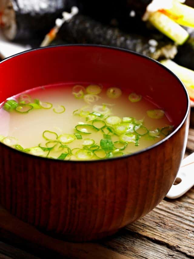 a bowl of miso soup in a restaurant.