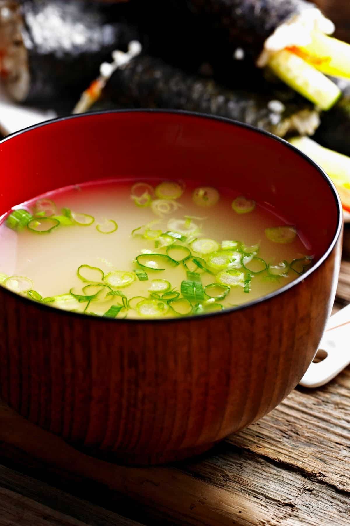 A bowl of miso soup in a restaurant.
