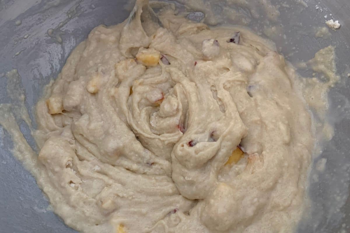 A bowl of peach cupcake batter.