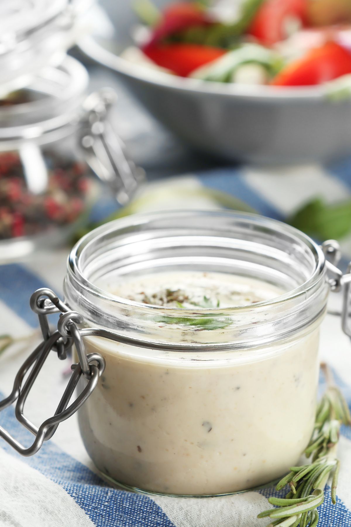 A small mason jar of homemade ranch dressing.