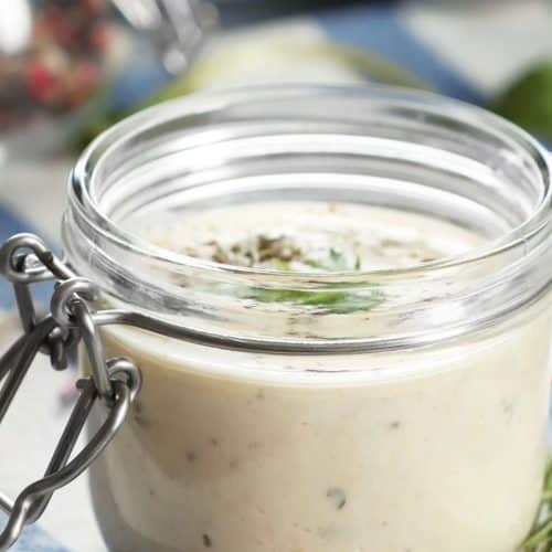 A small mason jar of ranch dressing.