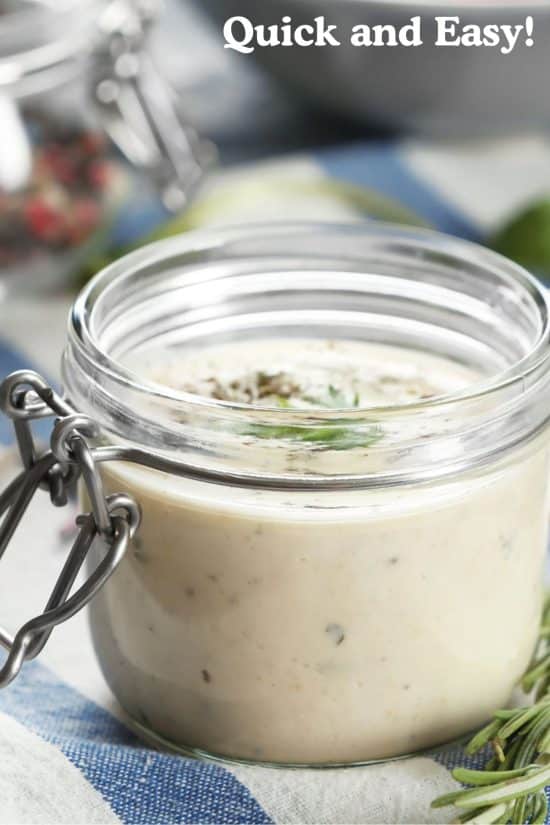 A small mason jar of ranch dressing.