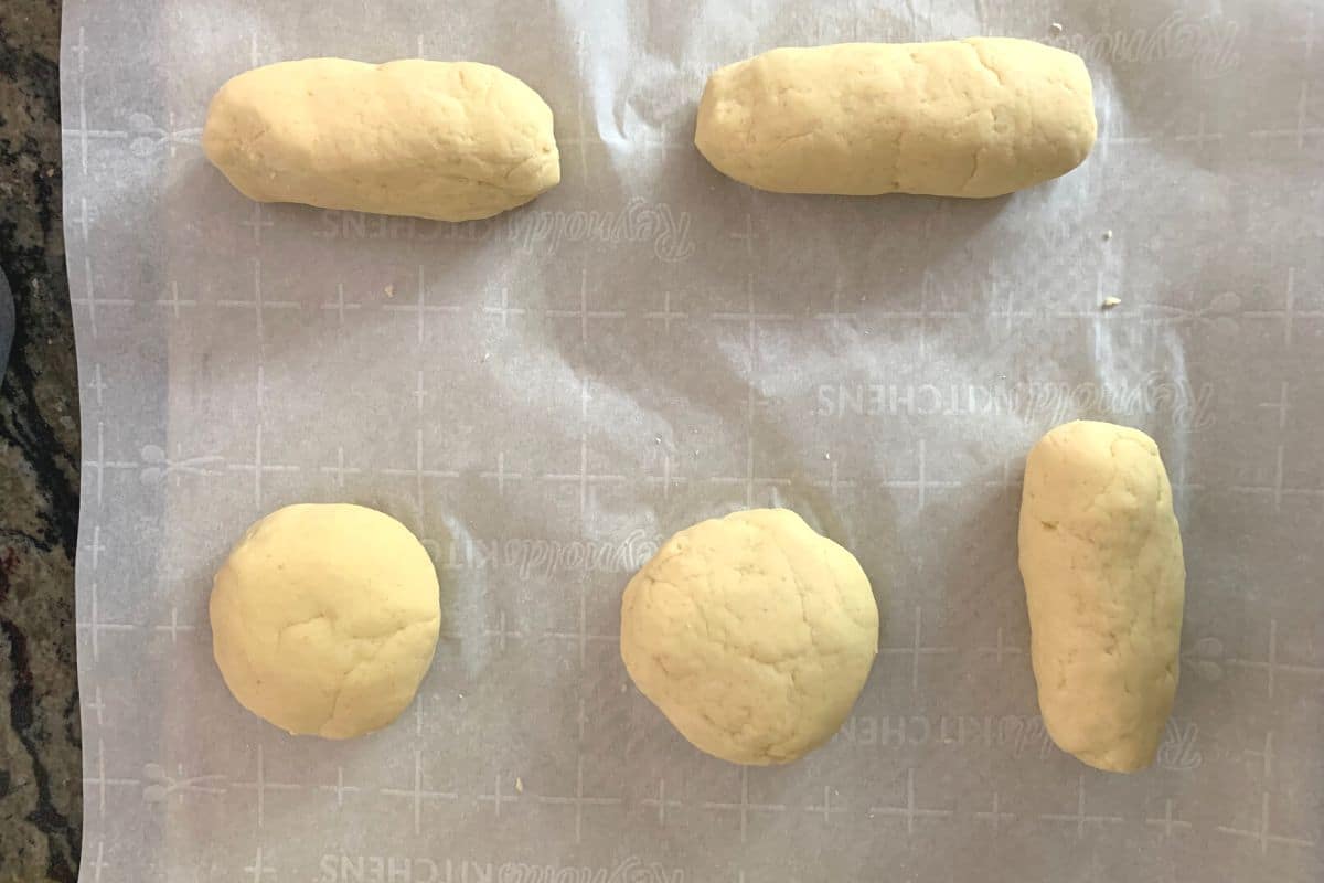 Photos of the buns rising on a cookie sheet.