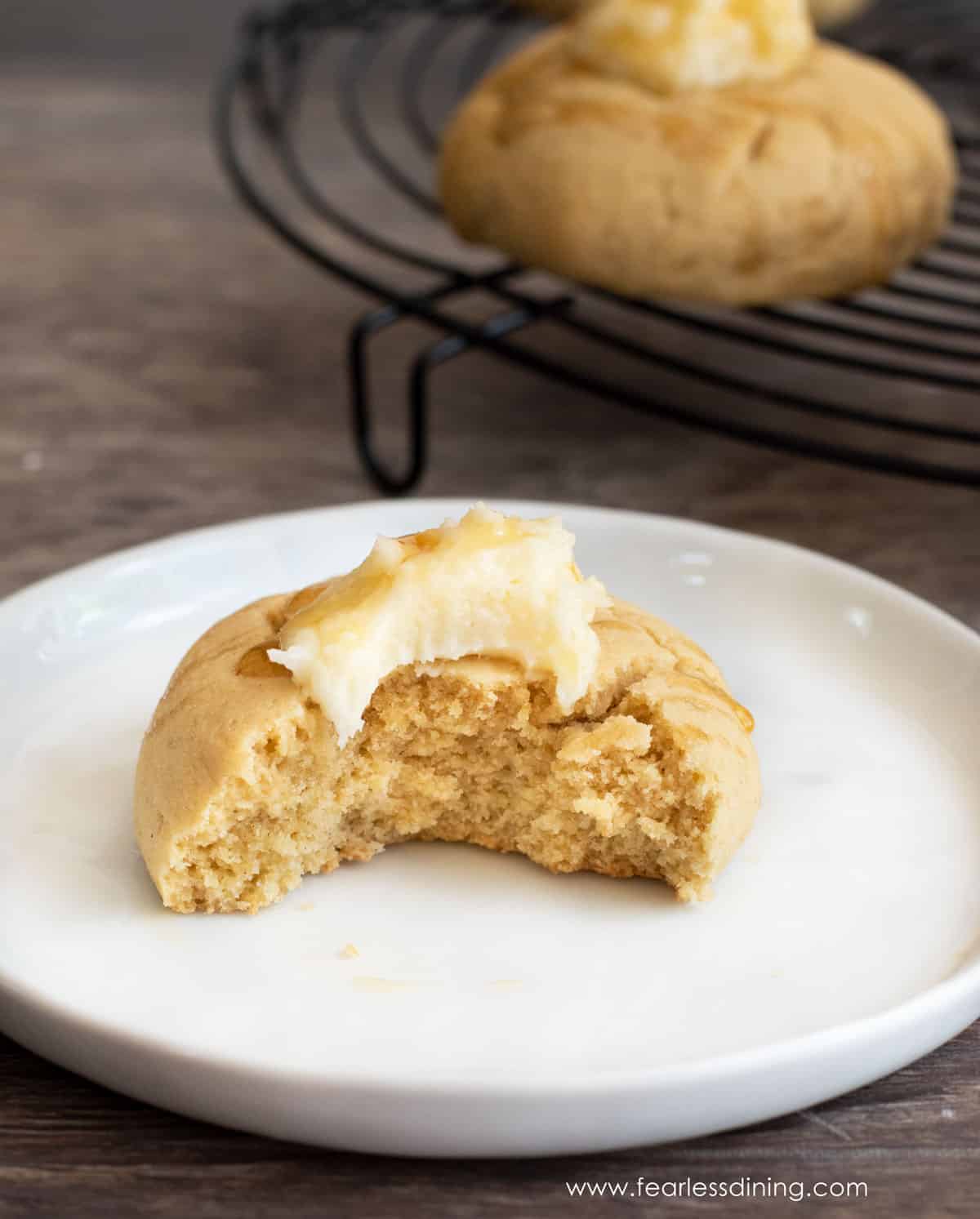 A cornbread cookie with a bite taken out.