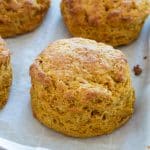 Gluten free pumpkin biscuits on a baking tray.