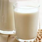a pin image of a glass of soy milk.