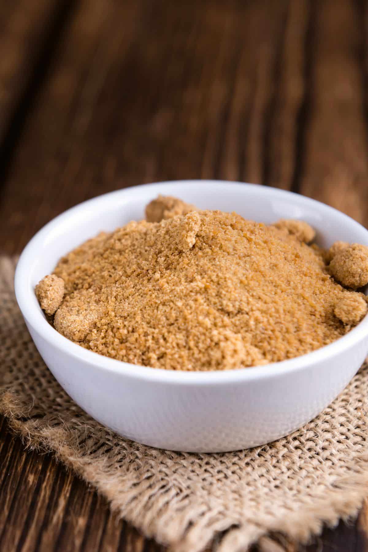 a bowl of coconut sugar on a table.
