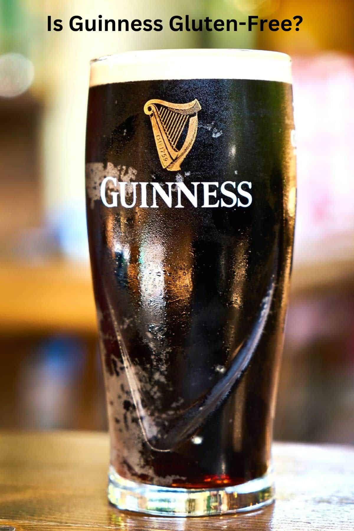 A pint of Guinness on a table.