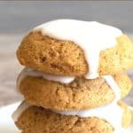 A Pinterest image of a stack of iced gluten free pumpkin cookies.