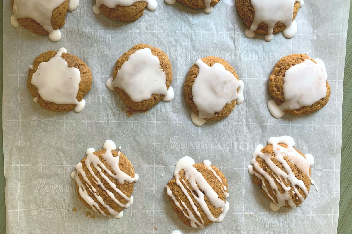 Cookies on a cookie sheet with icing.