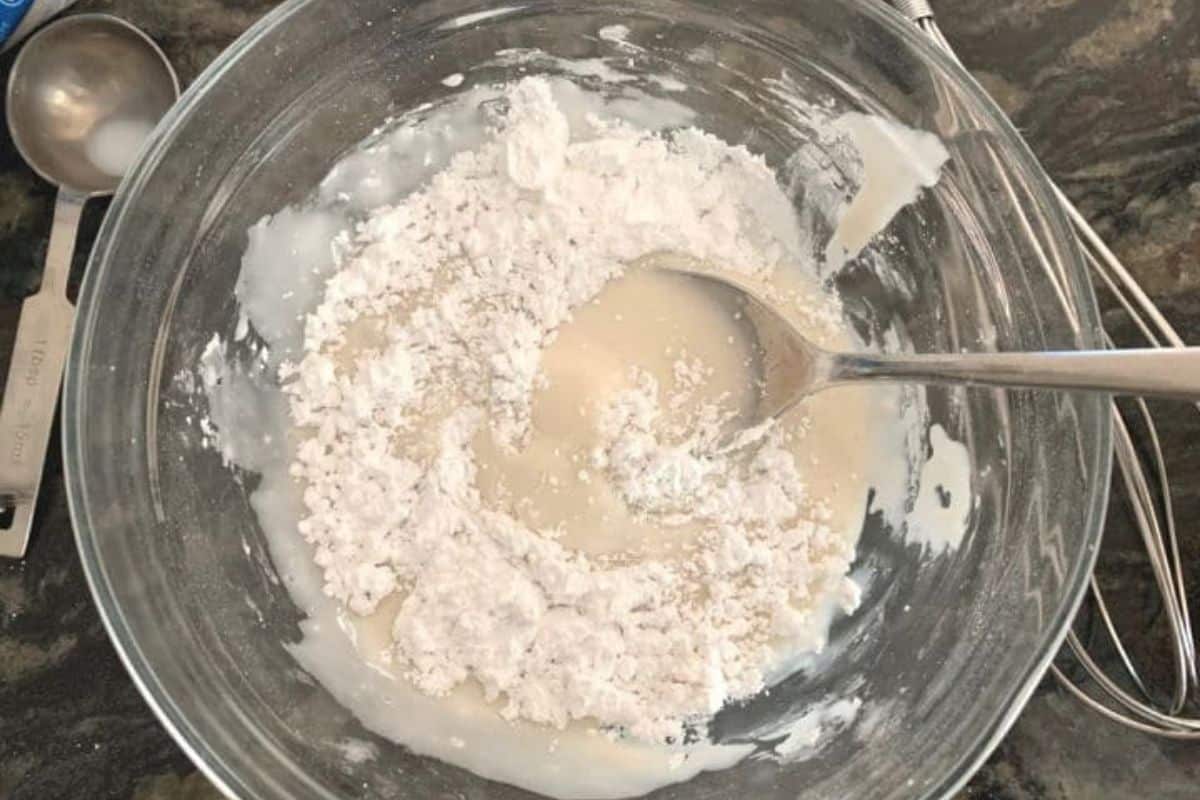 Mixing the icing in a small mixing bowl.