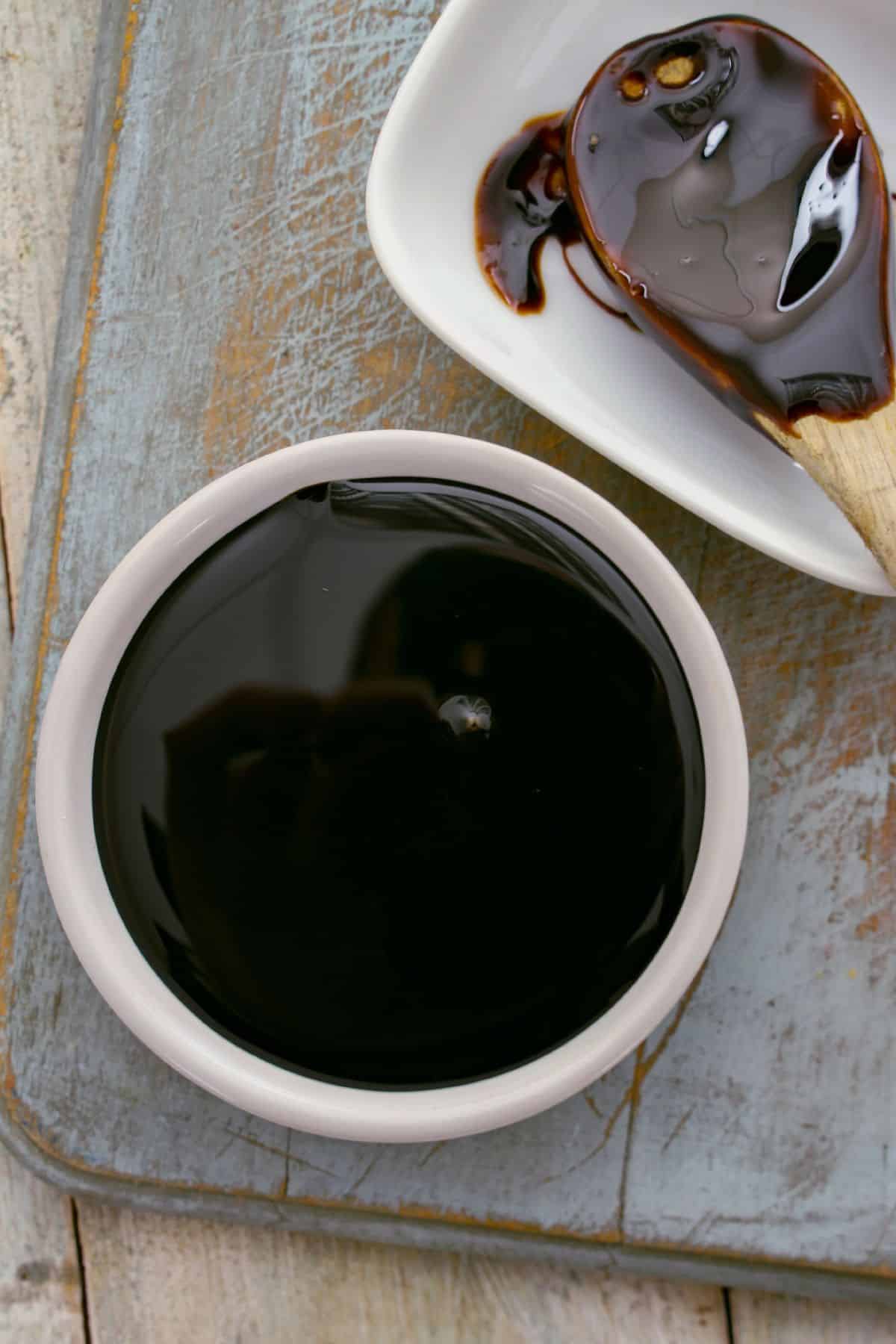 A small white bowl of molasses.