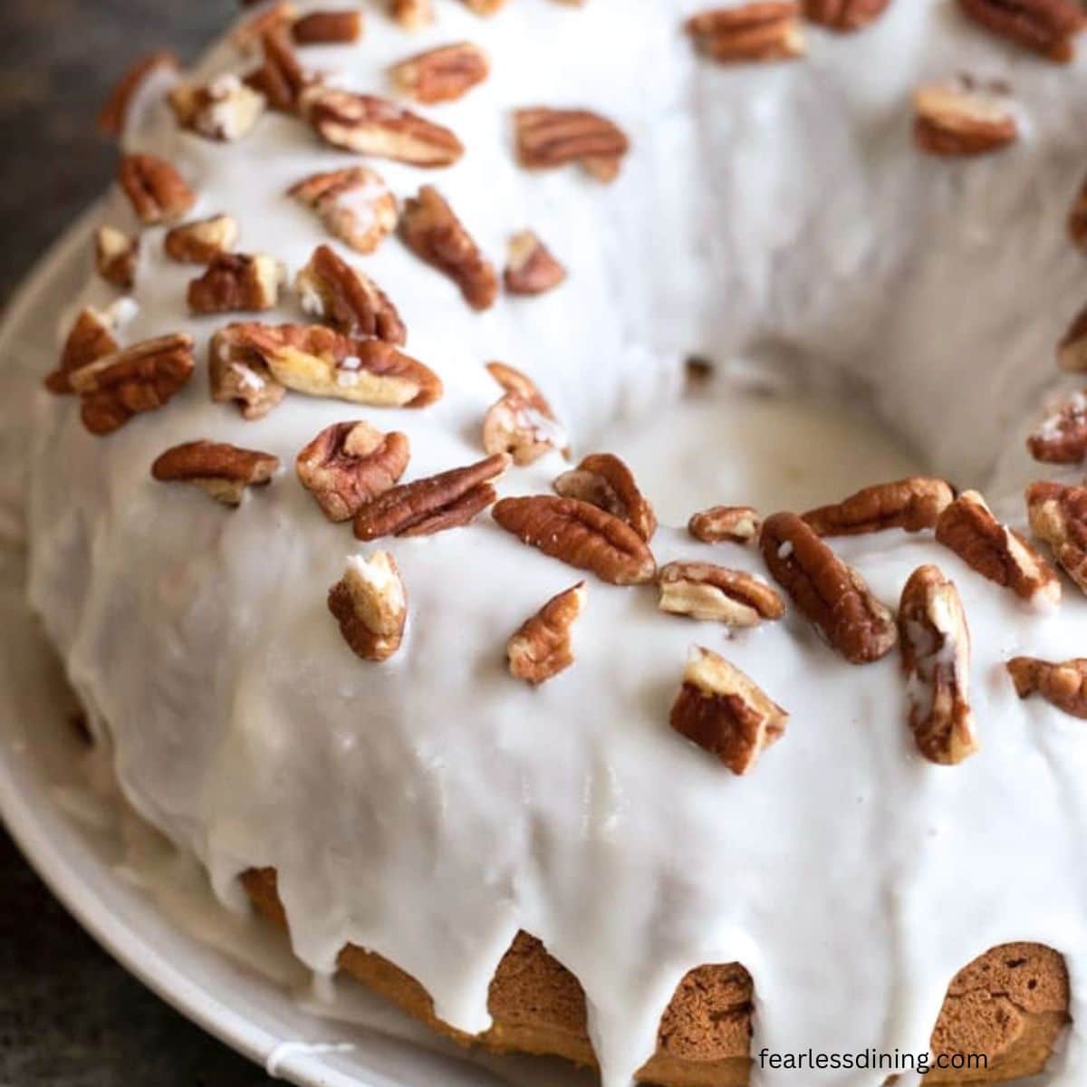 The top view of the baked, glazed gluten free pumpkin bundt cake.