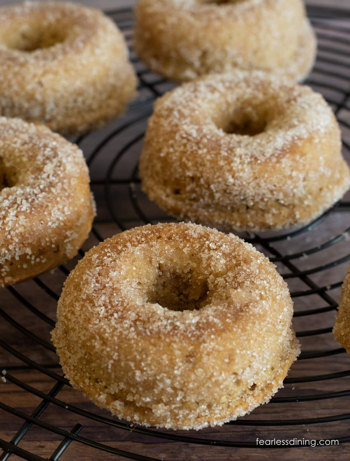 Apple cider donuts on a rack.