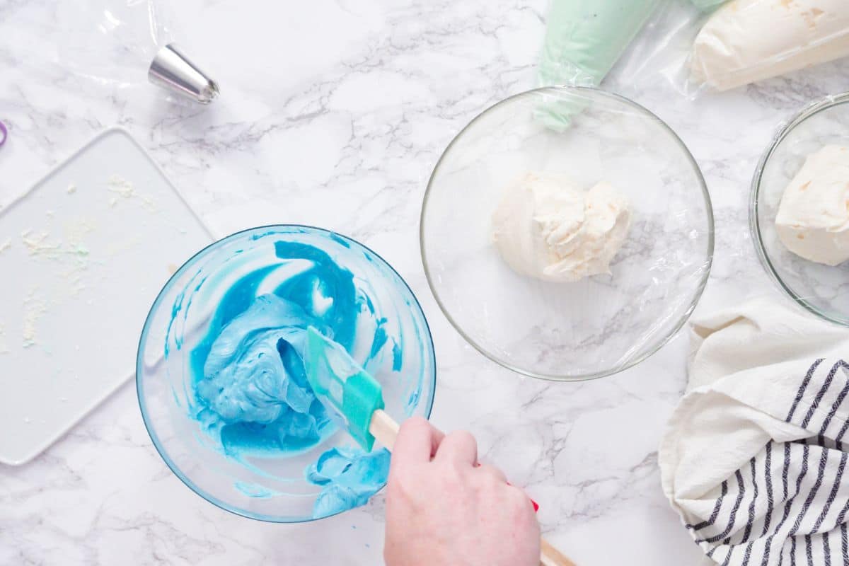 Coloring frosting in a small bowl.