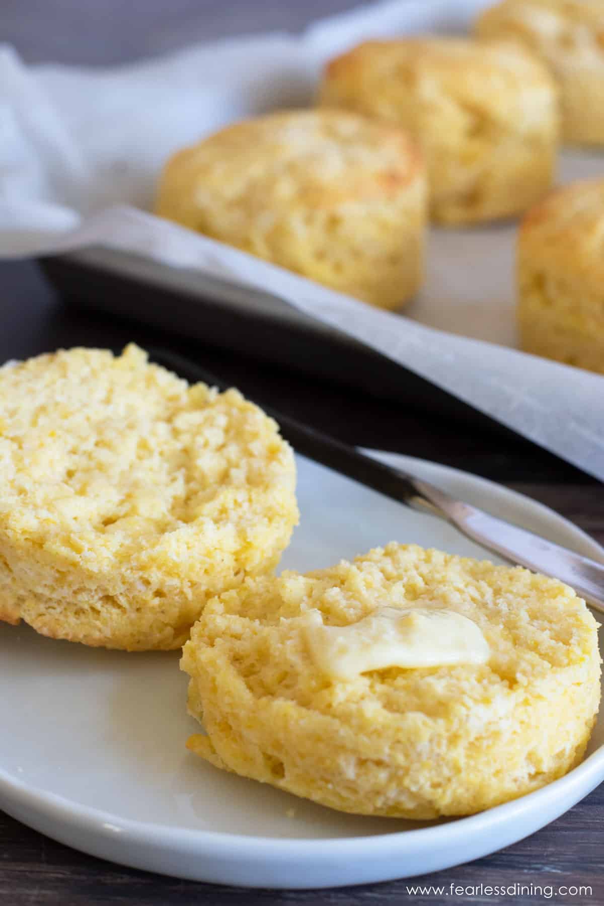 A cut biscuit with melting butter.