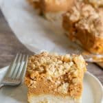 A pumpkin pie bar on a small white plate.