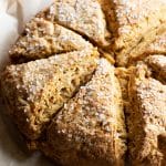 Baked gluten free pumpkin scones on a baking sheet.