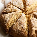 Baked pumpkin scones on a baking sheet.