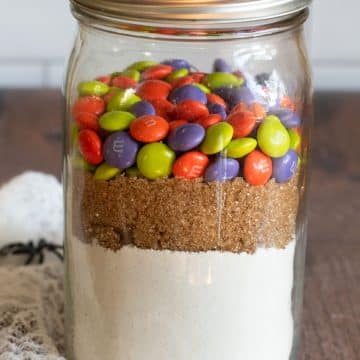 a mason jar filled with a gluten free Halloween cookie mix.