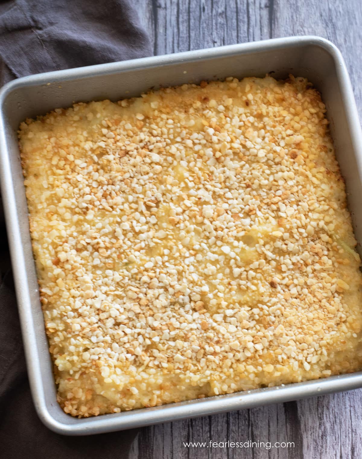 The top view of a baking dish full of mashed cauliflower gratin.