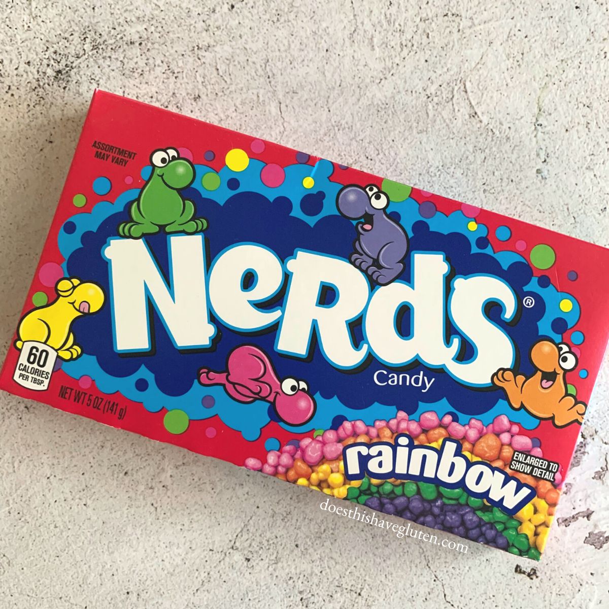 A box of nerds candy on a counter.