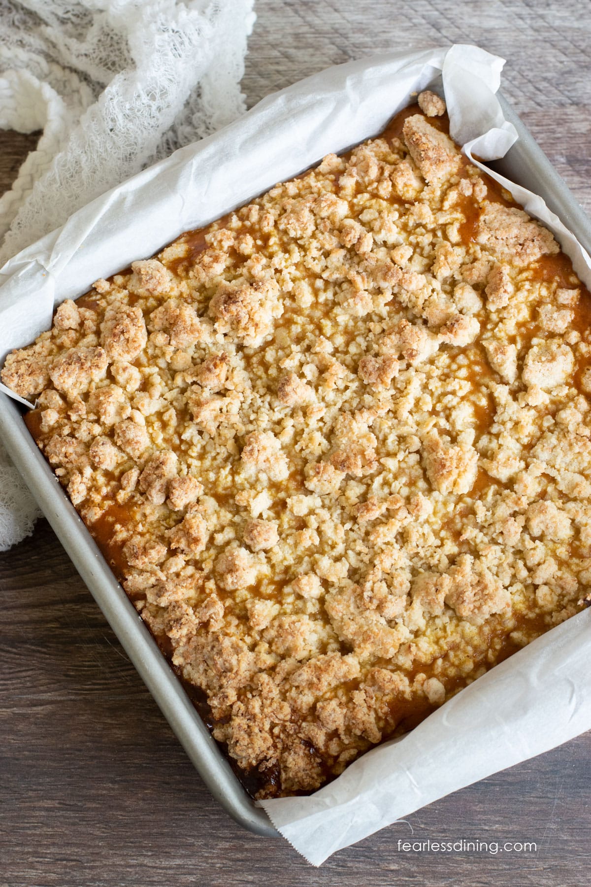 The baked pumpkin pie bars in an 8x8 pan.