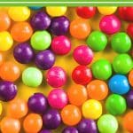 a pinterest image of skittles candy.