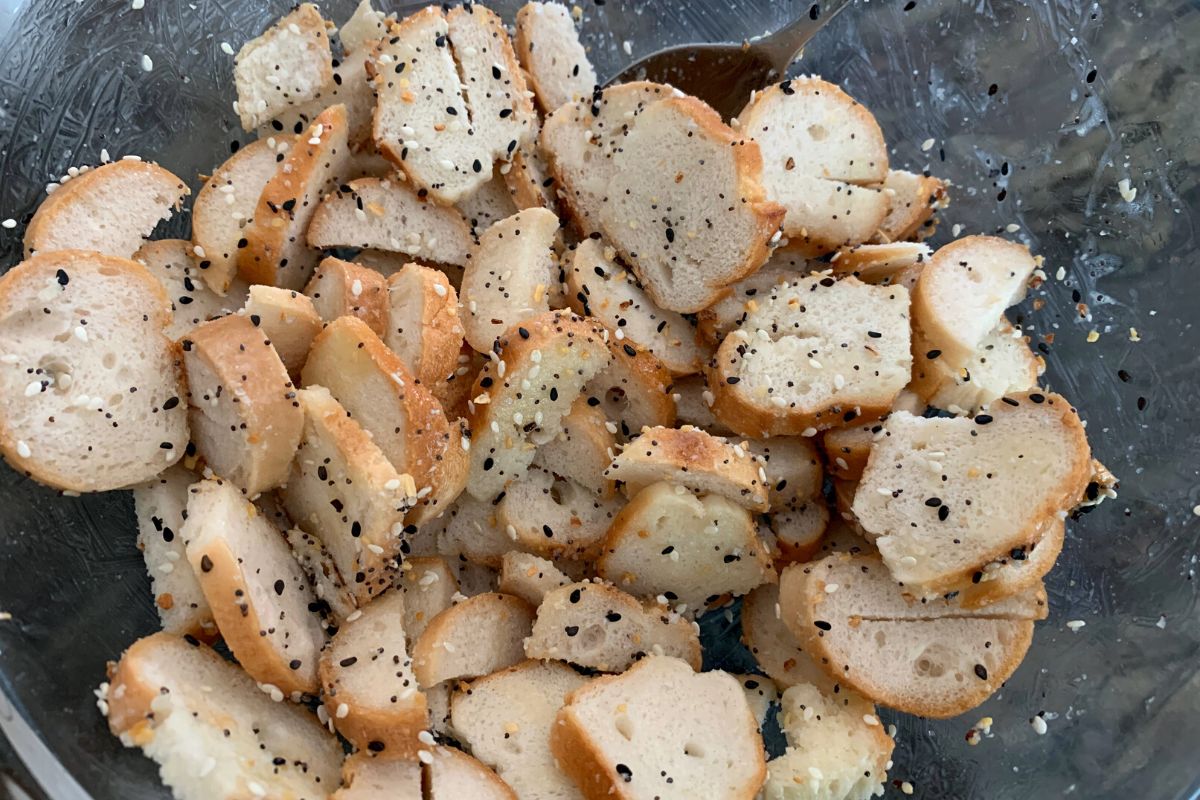 The bagel rounds after tossing with melted butter and seasonings.