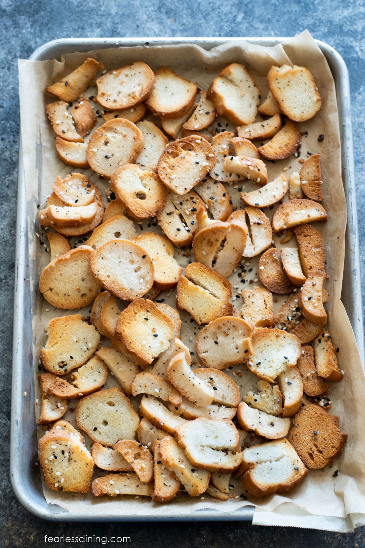 A baking dish with baked bagel chips.