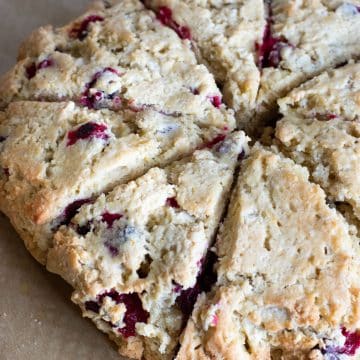 Baked scones on a cookie sheet.