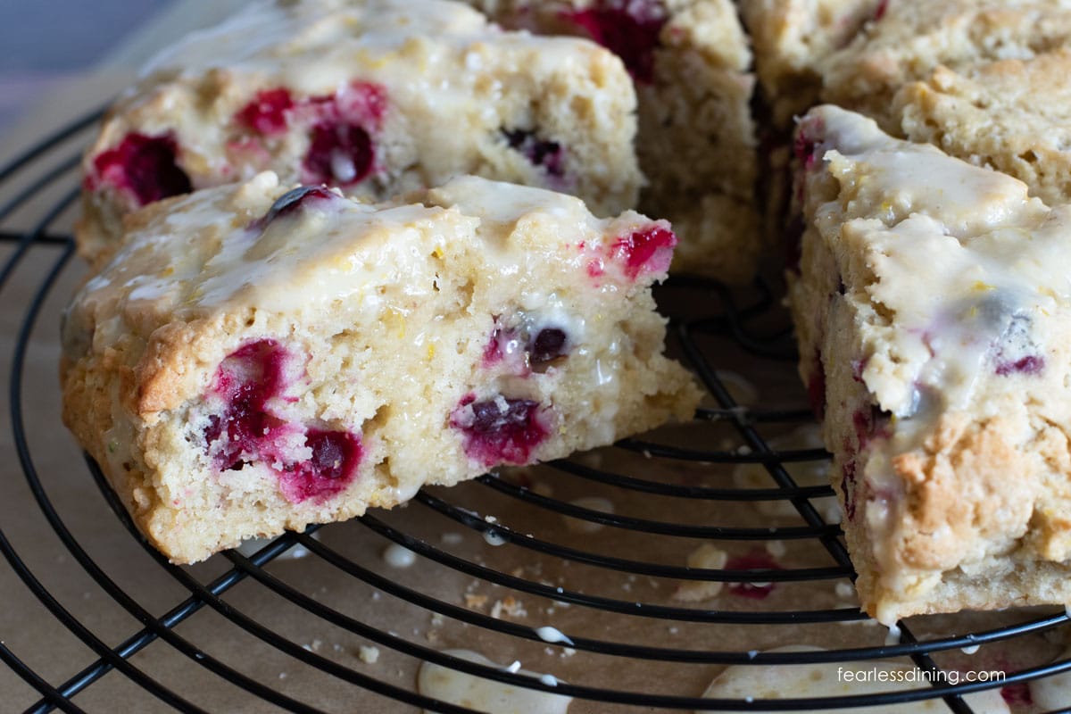 Iced cranberry scones on a wire rack.