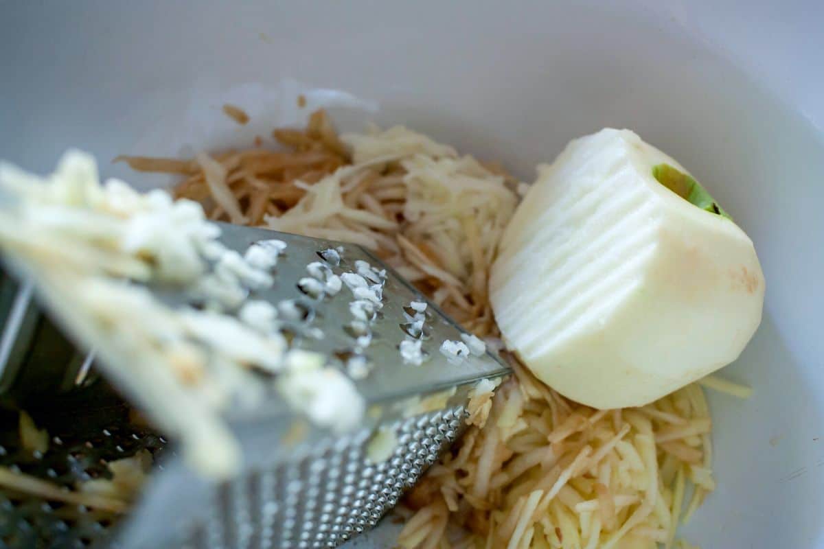 Grated apple in a bowl.