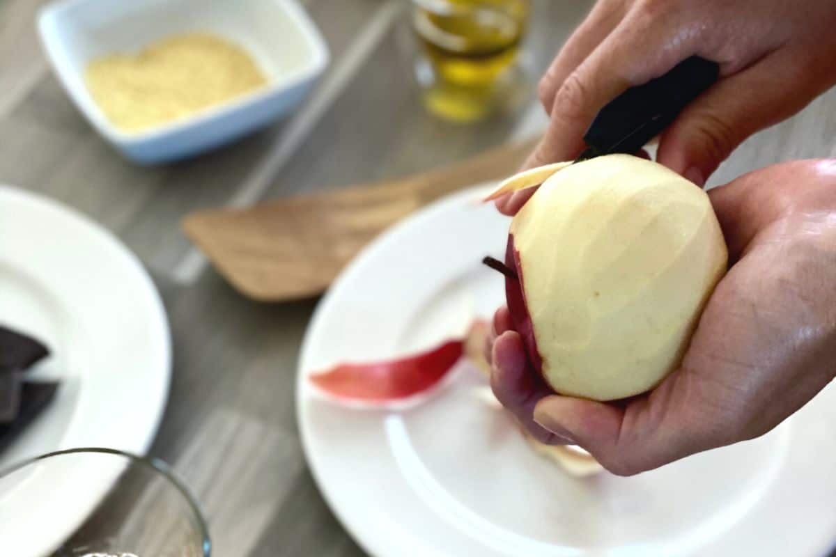 A photo of peeling an apple.