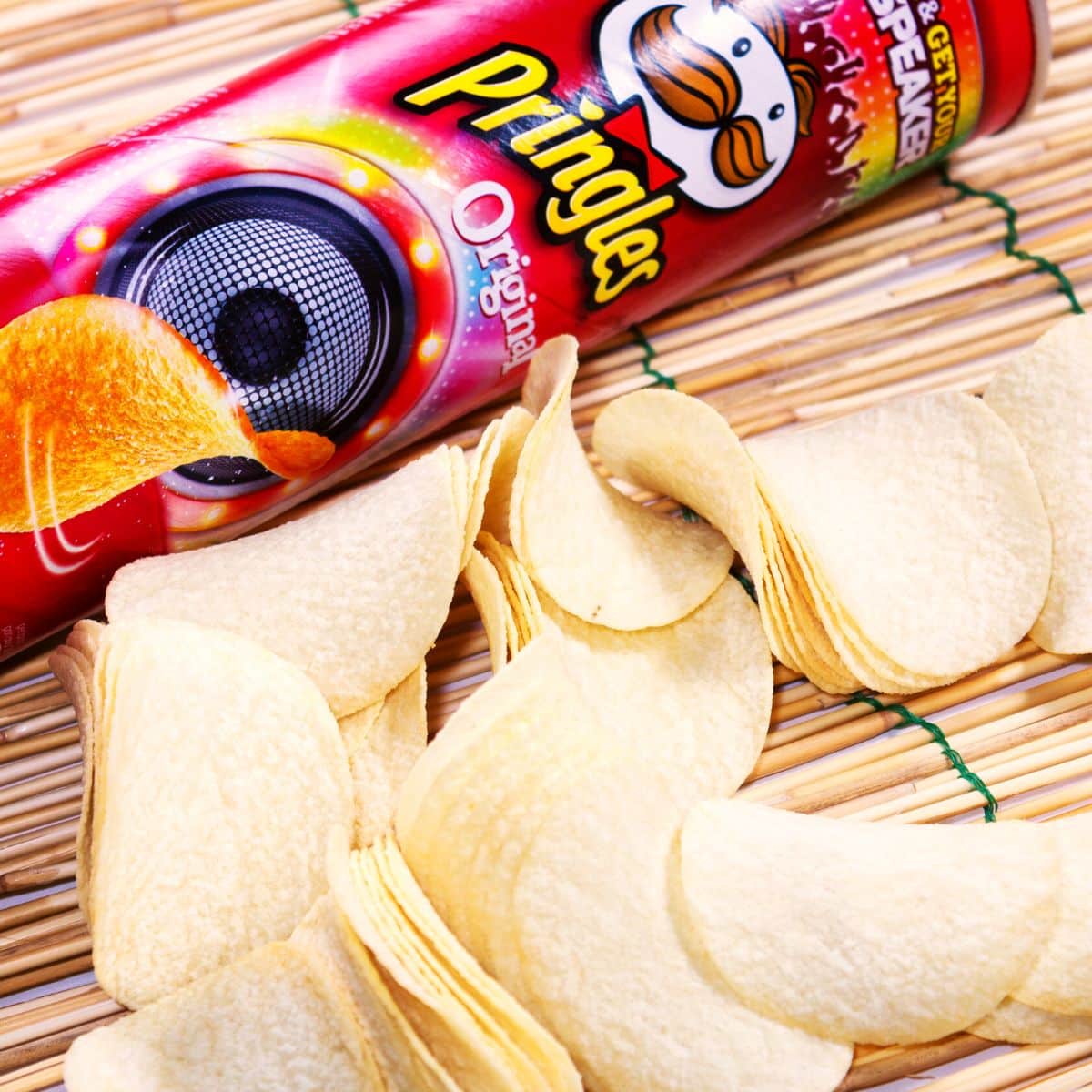 Pringles potato chips on a placemat next to the can.