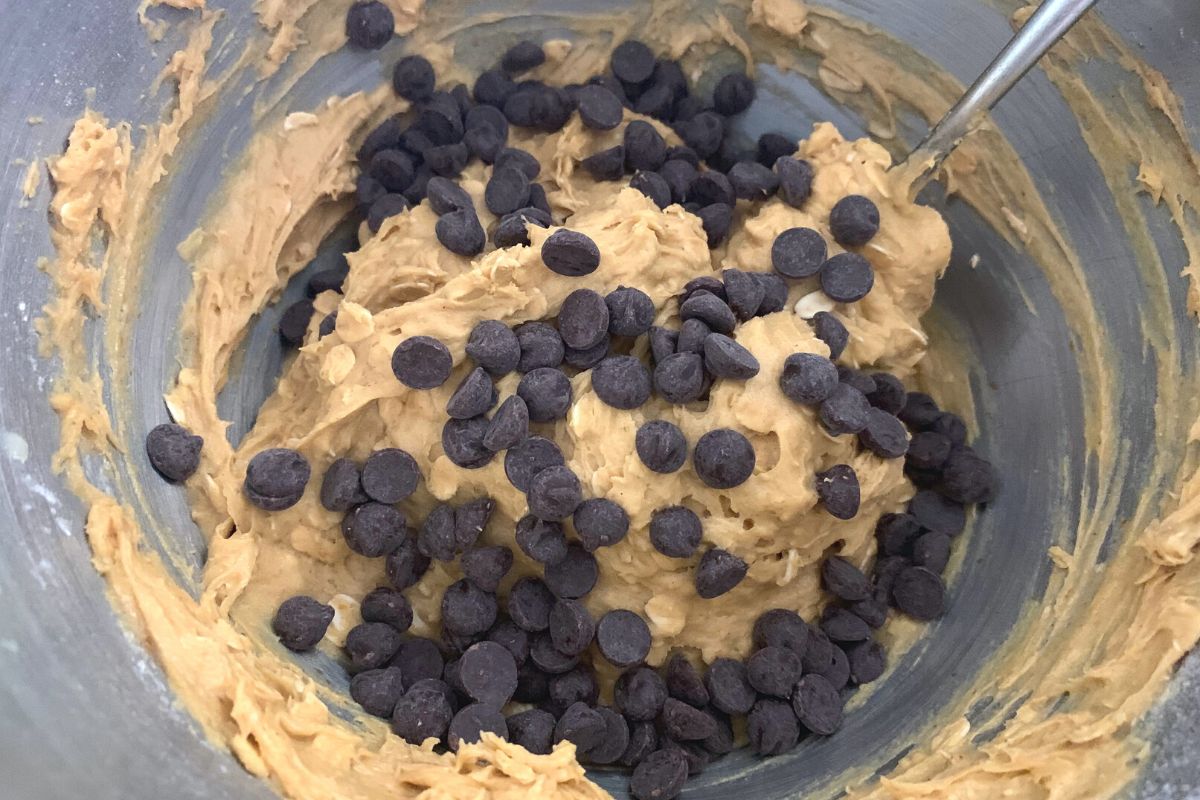 A bowl of pumpkin chocolate chip cookie dough.