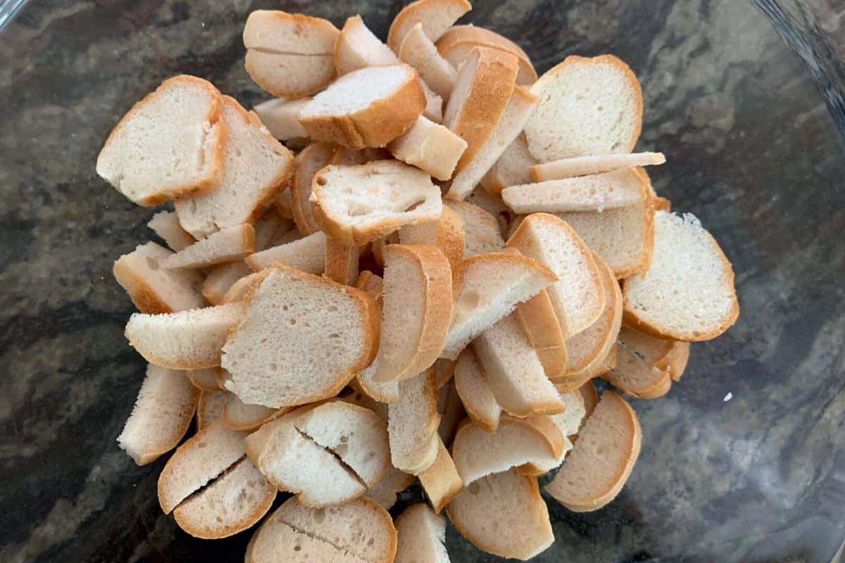 thinly sliced bagels in a large bowl.