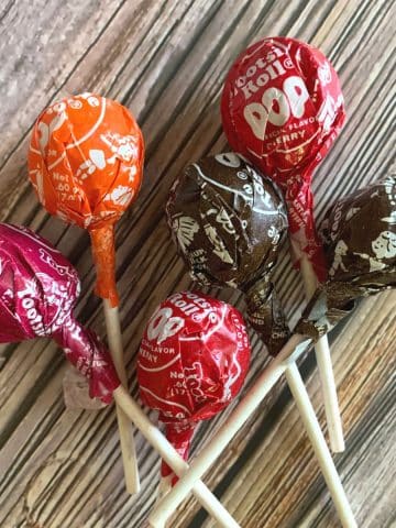 Tootsie pops on a table.