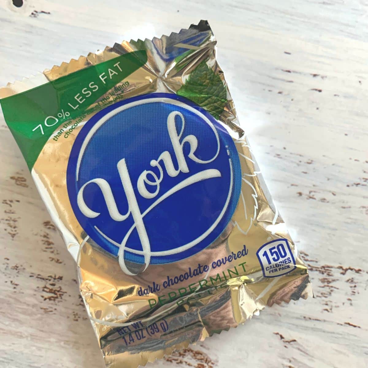 A york peppermint patty in its packaging on the table.